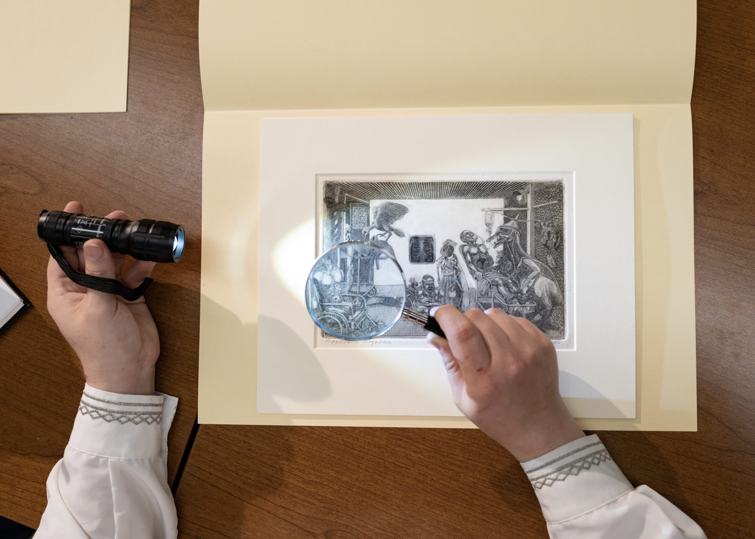 Art is inspected at the Doris Ulmann Galleries